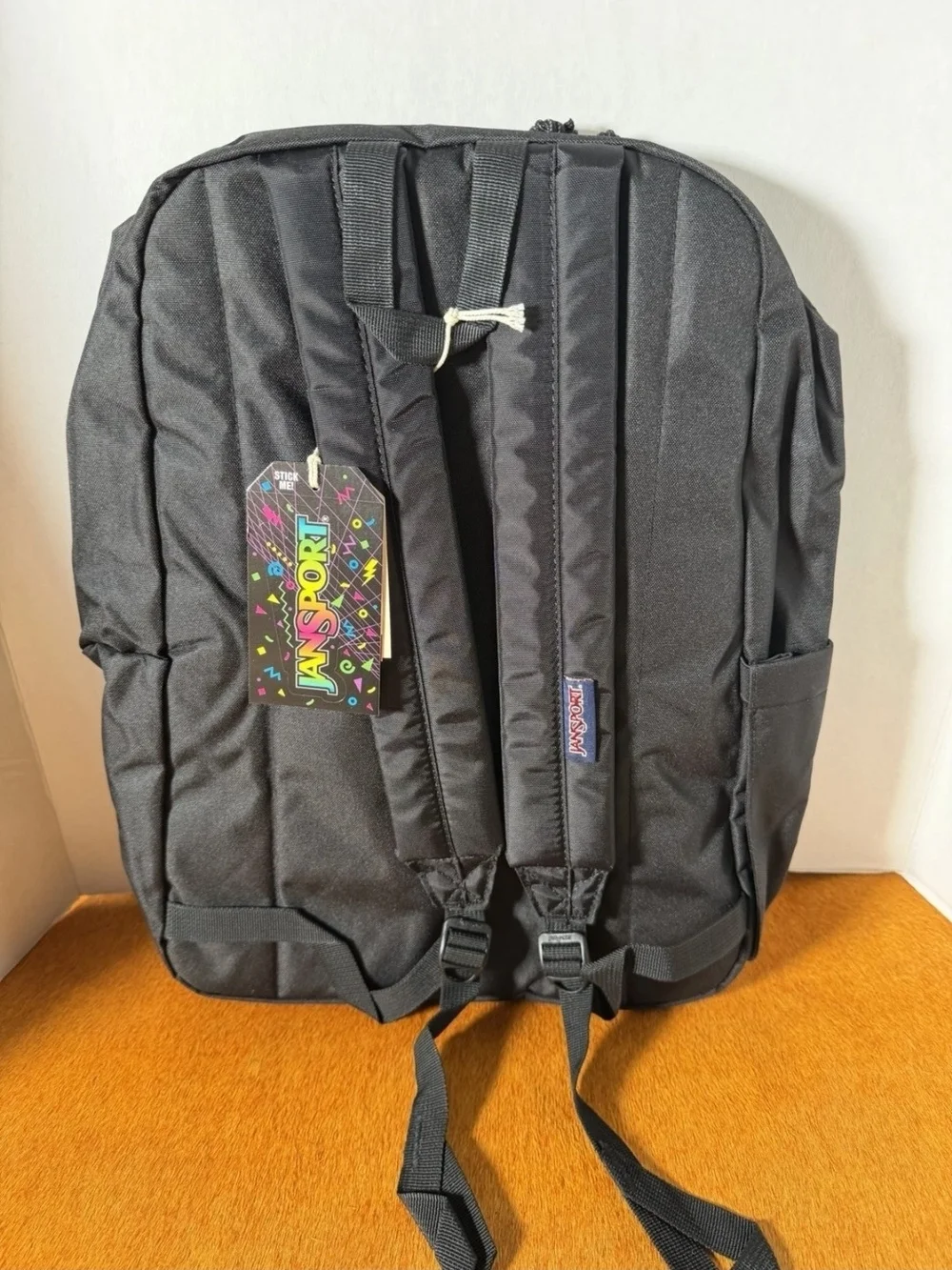Jansport Black Backpack with Navy Patch and Red Logo